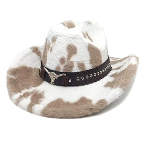 Cow print faux fur cowboy hat with silver bull head metal emblem and studded belt detail