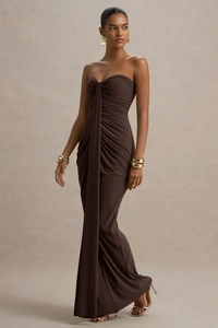 Detail of deep brown strapless dress with elegant crisscross pleated bodice design