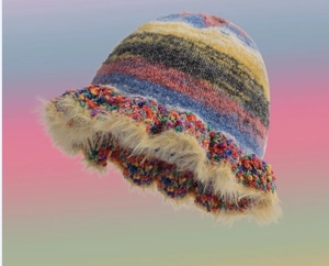 Close-up of knit bucket hat featuring colorful stripes and beige faux fur ruffle trim