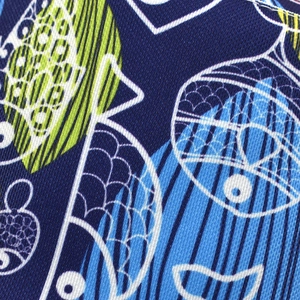 Detail of double-sided sun hat featuring blue sea animal print and fine stitching