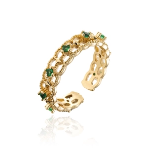 Detailed side view of 18K gold plated copper ring with green zircon and hollow carvings
