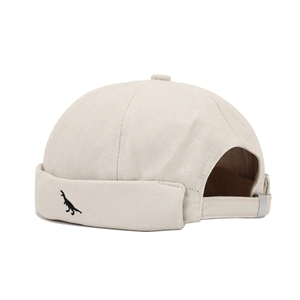 Beige cotton miki hat with black dinosaur embroidery and adjustable strap