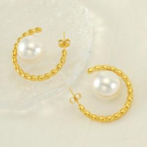 Elegant gold C-shaped hoop earrings with large pearls and beaded texture design