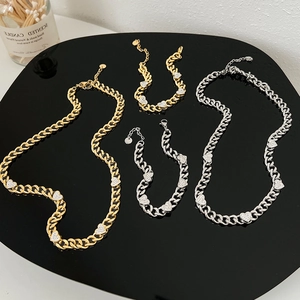 Cuban link necklace and bracelet set with rhinestone heart charms in gold and silver