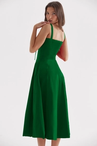 Detailed back view of a dark green satin slip dress showing elegant slim fit design