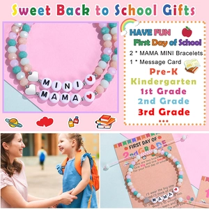 Close-up of Mama Mini beaded bracelets with macaron crystals and heart charm detail