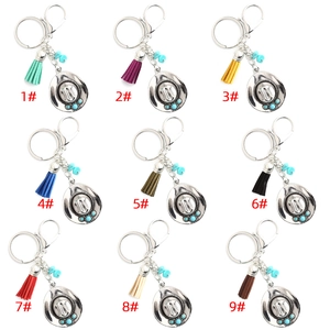 Detailed view of nine colorful bohemian cowboy hat tassels with turquoise stone accents