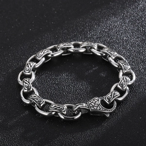 Detail of 12mm vintage punk cross link chain with engraved patterns and lobster clasp