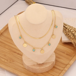 Double layered gold stainless steel necklace with turquoise bead and flower pendant