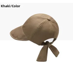 Detail of khaki cotton sun hat featuring a stylish back ribbon bow and breathable eyelets