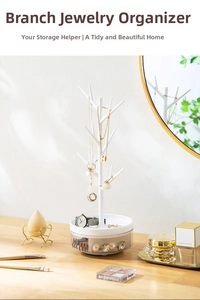 Detailed view of white tree-shaped jewelry organizer with tray and drawer storage