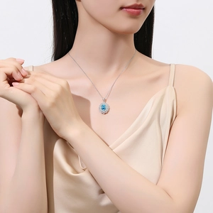 S925 sterling silver necklace with oval aquamarine zircon pendant on a model