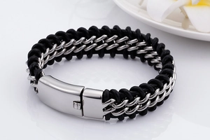 Detail of black woven leather strap and silver stainless steel chain on men's bracelet