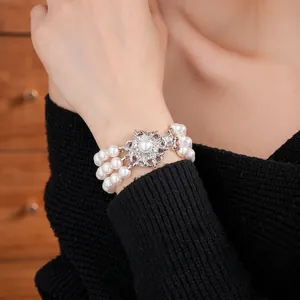 Three-layer pearl bracelet featuring a vintage floral diamond-set clasp for women