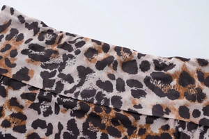 Close-up of leopard print fabric detail on slim fit summer top and skirt set for women