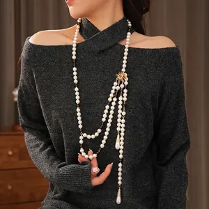 Vintage layered pearl necklace with gold flower accent and teardrop pendants for women