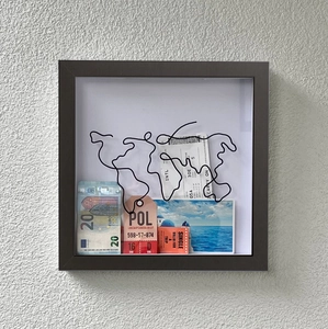 Travel shadow box frame with world map sculpture, souvenirs, tickets and postcards