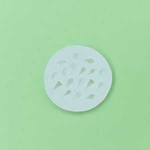 Detail of light blue silicone mold with mini ice cream and popsicle shapes for fondant