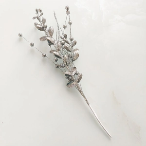 Close-up of glittery silver artificial berry branch stems for Christmas DIY decoration
