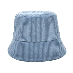 Detailed texture of light blue corduroy fabric on a minimalist bucket hat surface