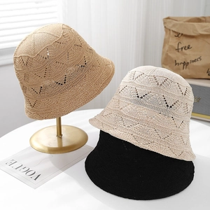 Detail of hollow heart-shaped knit pattern on breathable mesh sun hats in multiple colors