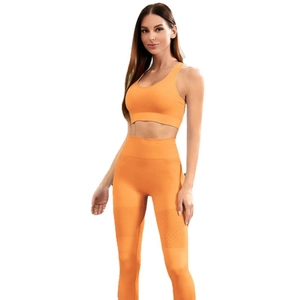 Orange two-piece seamless ribbed yoga set with sports bra and high waist leggings