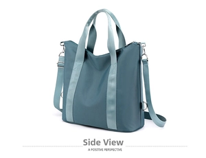 Detail of blue waterproof nylon tote bag showing metallic D-ring and smooth texture