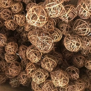 Stack of 5cm natural brown rattan balls for rustic Christmas decor and pet toy usage