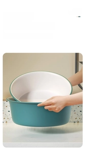 Detail of dual-color green and white basin featuring widened ergonomic rolled edges