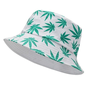 White canvas bucket hat with green leaf prints shown in a 45-degree angle view