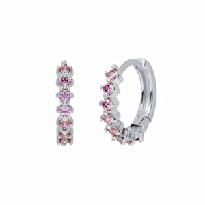 Close-up of S925 silver huggie earrings with prong-set pink cubic zirconia stones