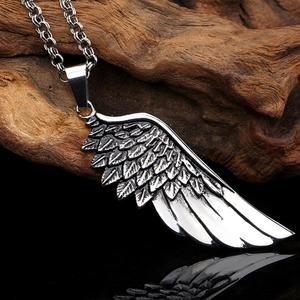 Mens stainless steel angel wing feather pendant necklace on rustic wood background