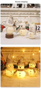 Detail van lichtgevende LED kerstfiguren van gebreide stof met warm lichteffect