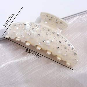 Macro detail of cream acetate hair claw clip with rhinestones showing 9.5cm dimensions