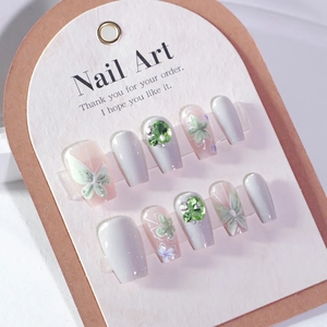 Handmade 3D floral press-on nails with green rhinestones and butterfly patterns