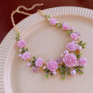 Golden floral necklace with pink resin roses, green enamel leaves and faux pearls