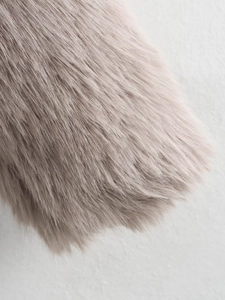 Close-up of premium taupe faux fur texture with high-density fibers and soft gloss finish