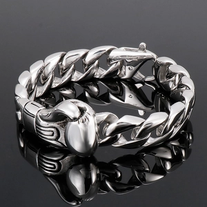 Detailed view of 316L stainless steel engraving on silver Cuban chain with boxing glove