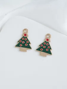 Detail of DIY Christmas tree pendants with green enamel and gold alloy edges