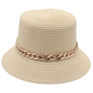 Chic beige woven straw bucket hat featuring a decorative rose gold acrylic metal chain detail