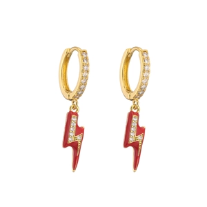 Close-up of golden lightning bolt earrings with red enamel and micro zircon inlay detail