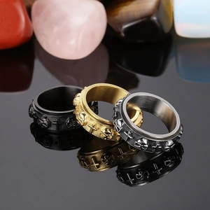 Three-color spinning stainless steel rings with punk skull and cross relief patterns