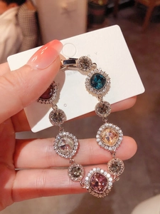 Close-up of multicolored gemstone 925 silver bracelet with sparkling pavé crystals