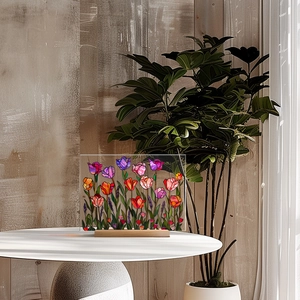 Floral acrylic table decor with colorful tulips and wooden base in a bright office setup