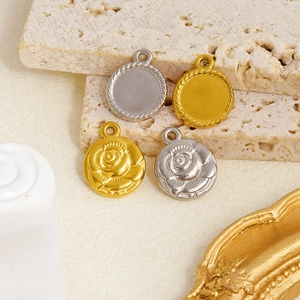 Detailed macro view of 304 stainless steel rose embossed and round textured pendants