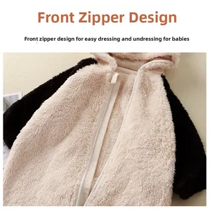 Macro shot of fluffy plush baby jumpsuit fabric featuring smooth front zipper closure