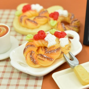 Miniature Christmas wreath donuts and puff pastries resin ornaments on white tray