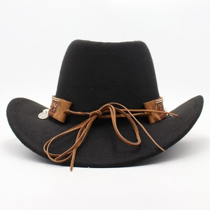 Detail of black wool felt cowboy hat with ethnic braided band and silver metal pendant