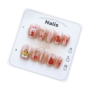 Cat eye press-on nails with Chinese New Year dragon and firework art on display card
