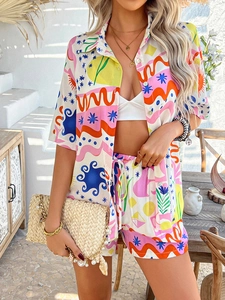 Detail of vibrant boho-print shirt and shorts set with colorful abstract patterns